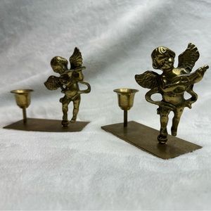 Pair of brass cherub candlestick holders